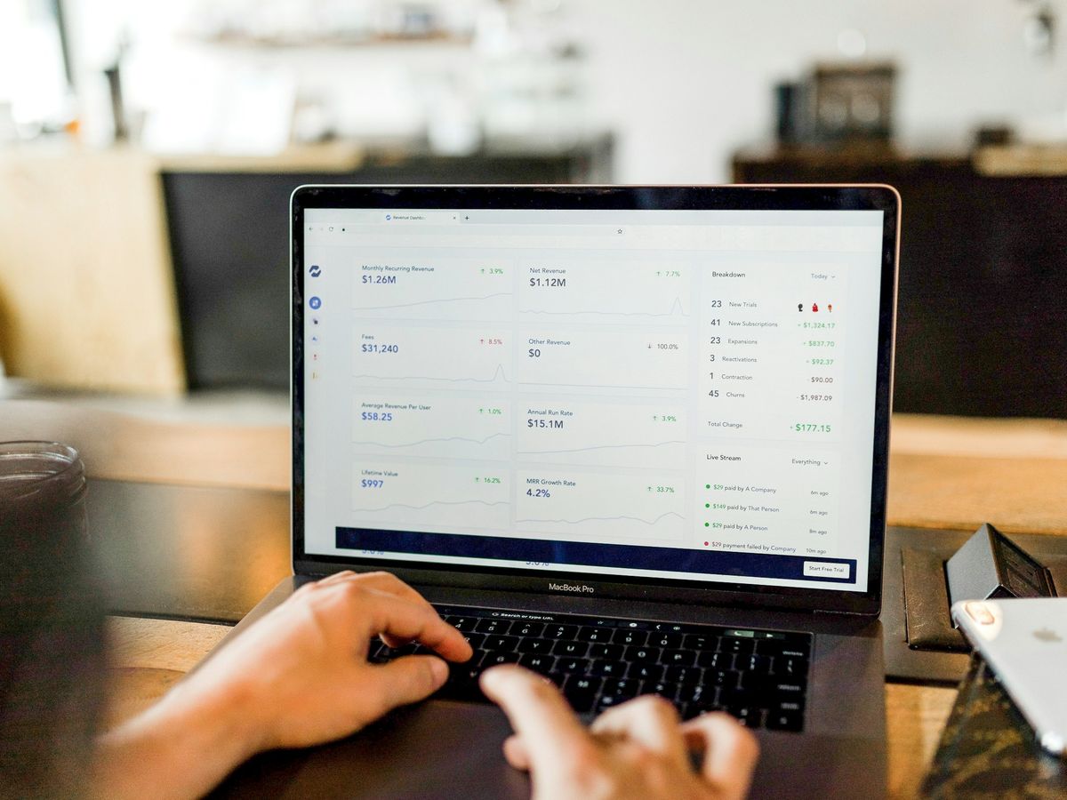A web system dashboard open on a laptop