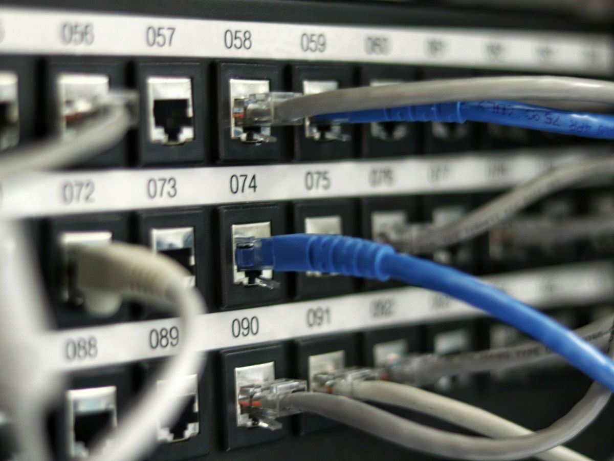 Server cabinets in a darkened equipment room